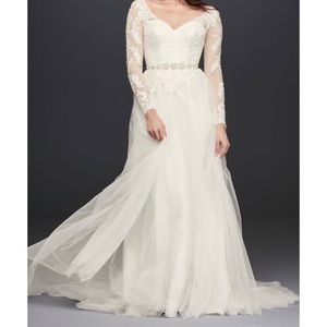 ivory long sleeve, low corset back, bustled wedding gown